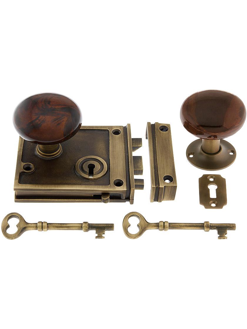 Solid Brass Horizontal Rim Lock Set with Bennington Style Porcelain Knobs.